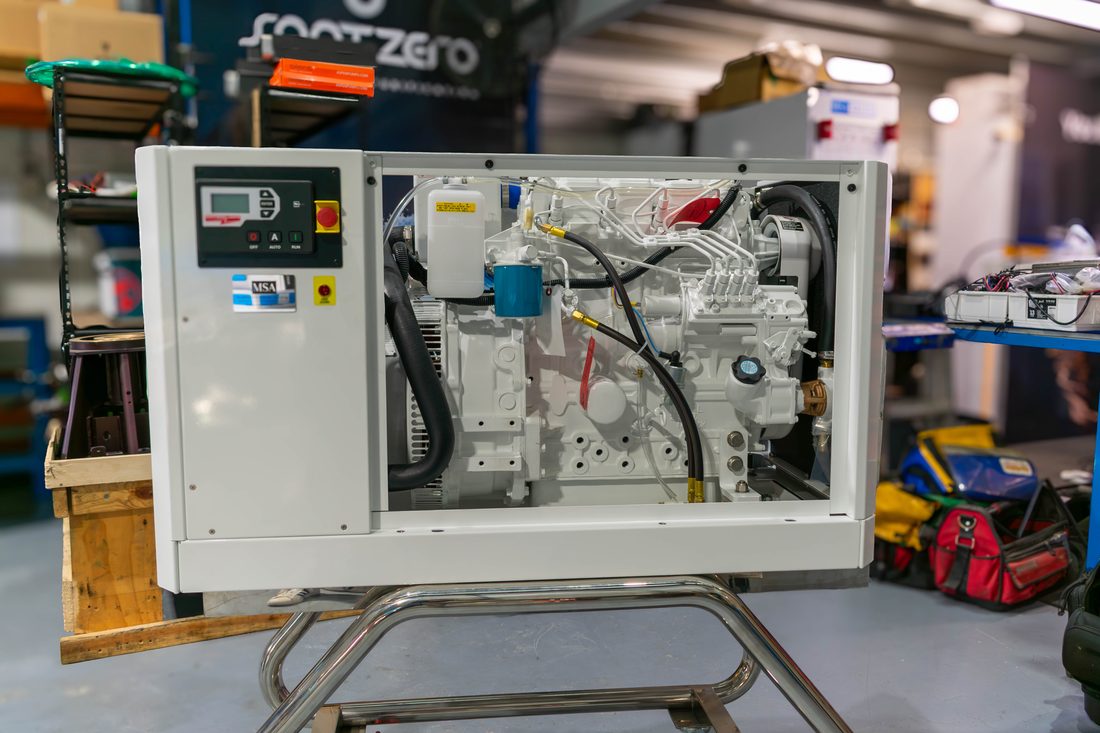 Northern Lights generator with the enclosure open, showing the diesel engine