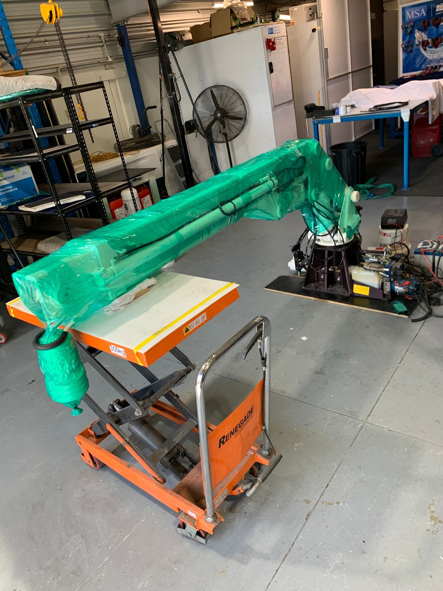 Assembled crane wrapped on the lift table, ready for the truck