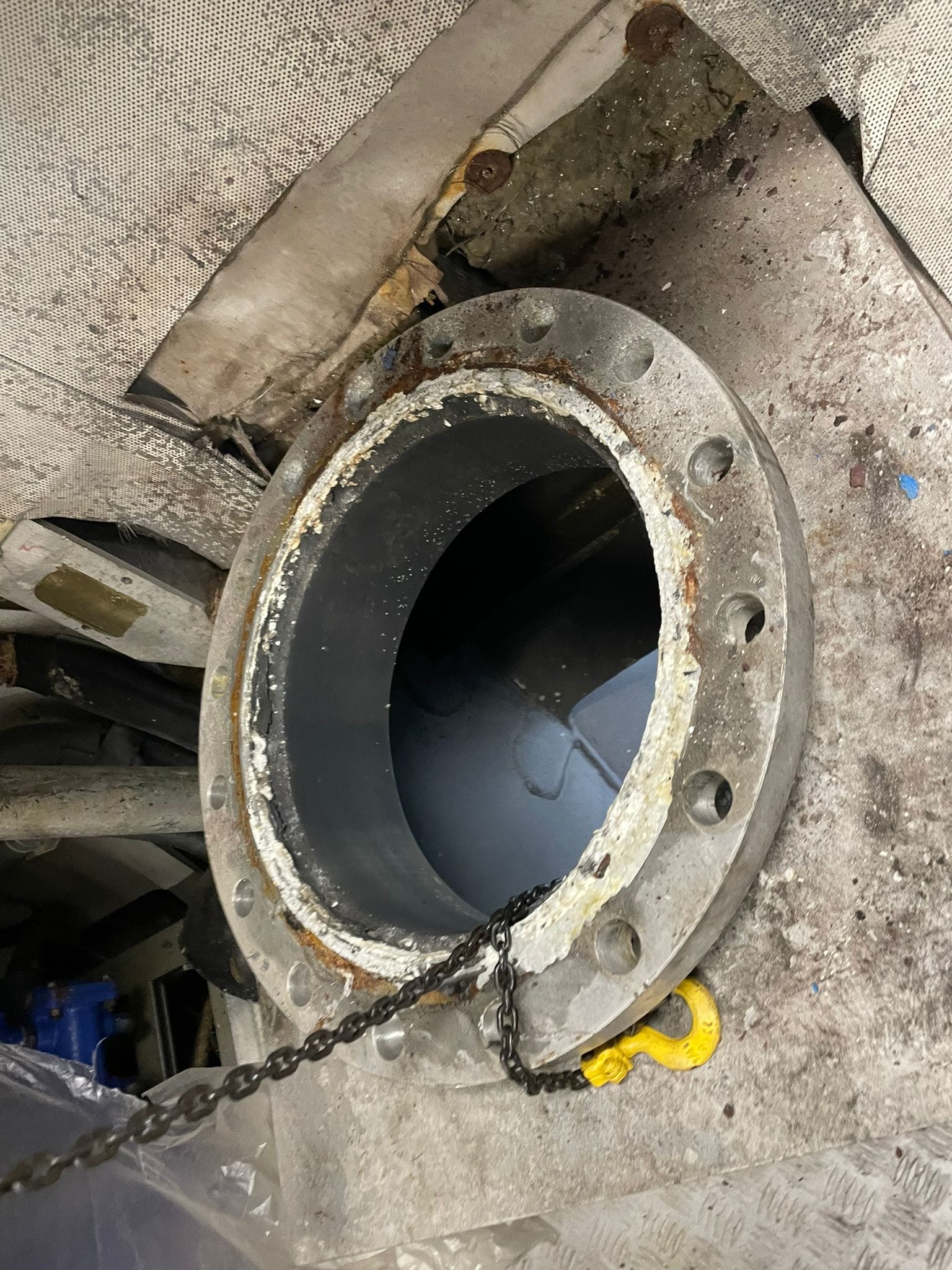 Main valve off, chain hoist rigged through the open exhaust flange
