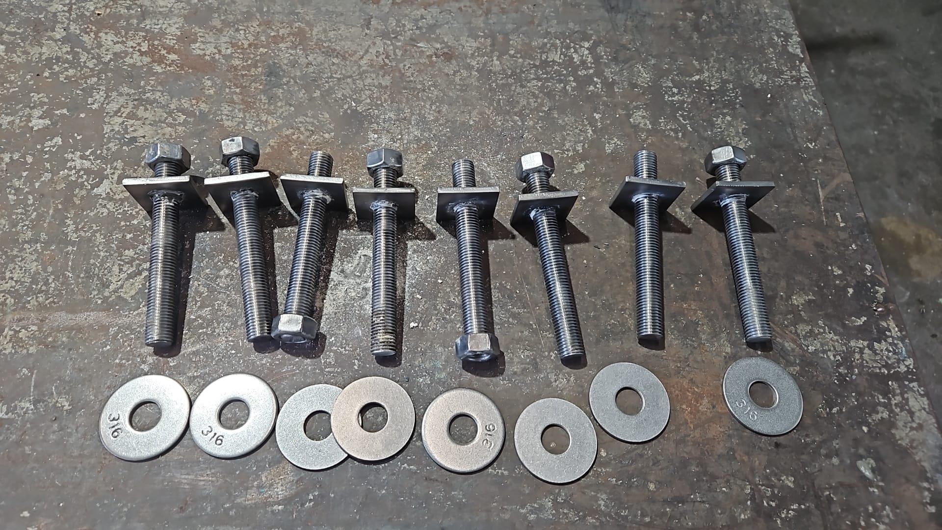New 316 stainless mounting studs fabricated with welded backing plates