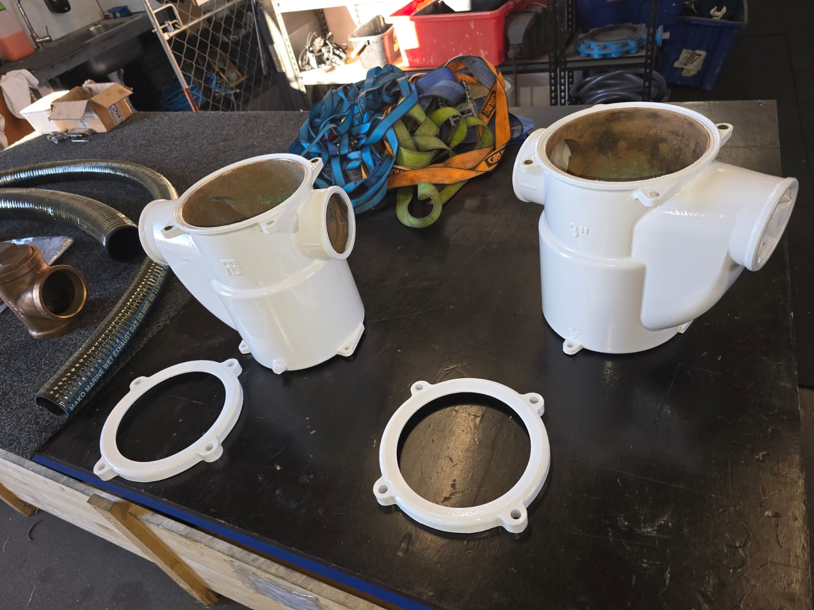 Refurbished strainer housings repainted with new machined lid rings