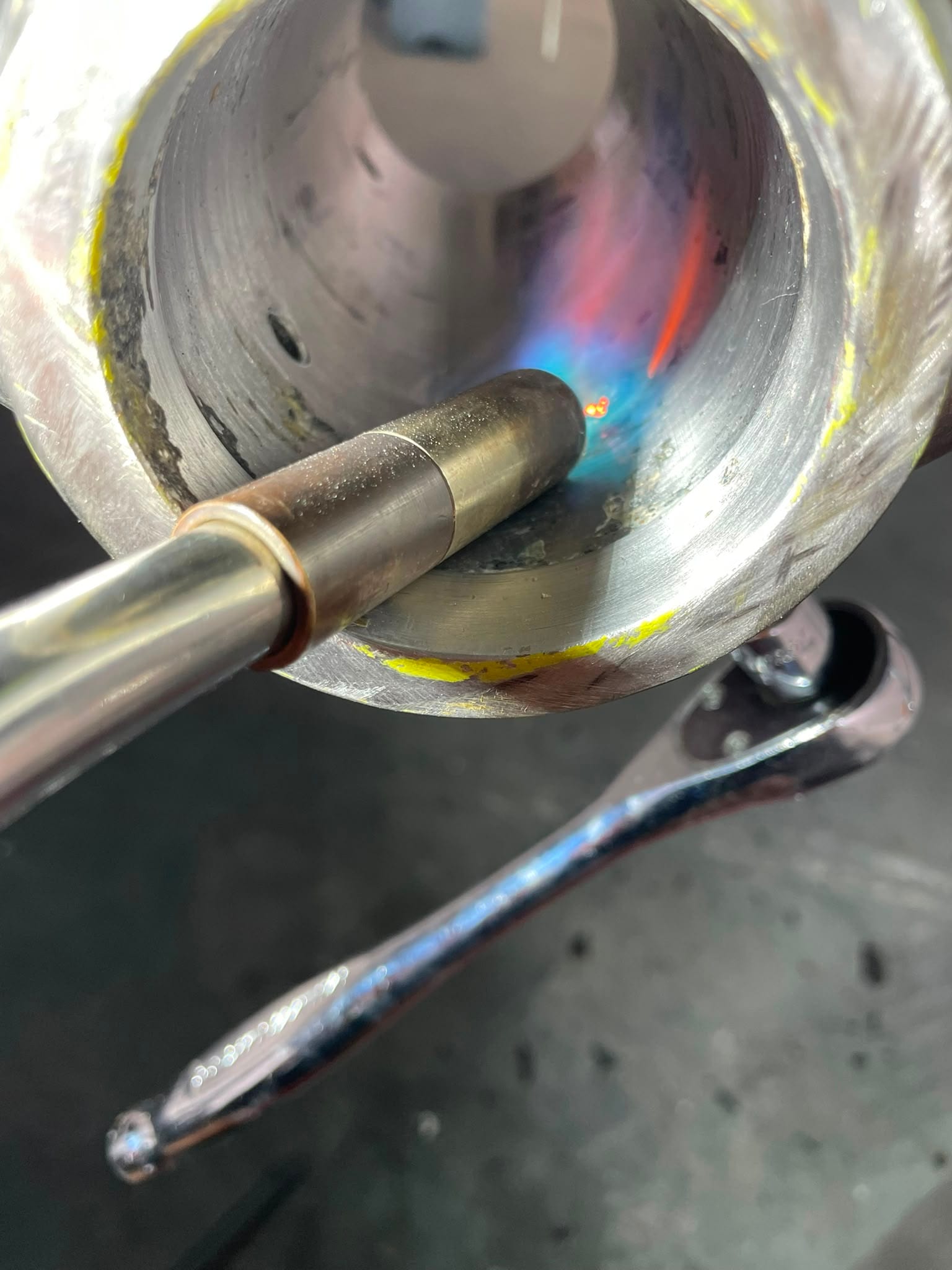 Slow, local heat on the seized grub screw rather than drilling it out