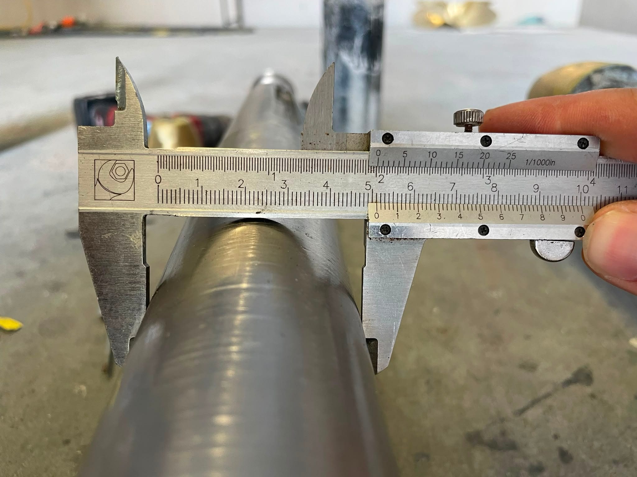 The cleaned shaft under the vernier, still within tolerance for 2 inches