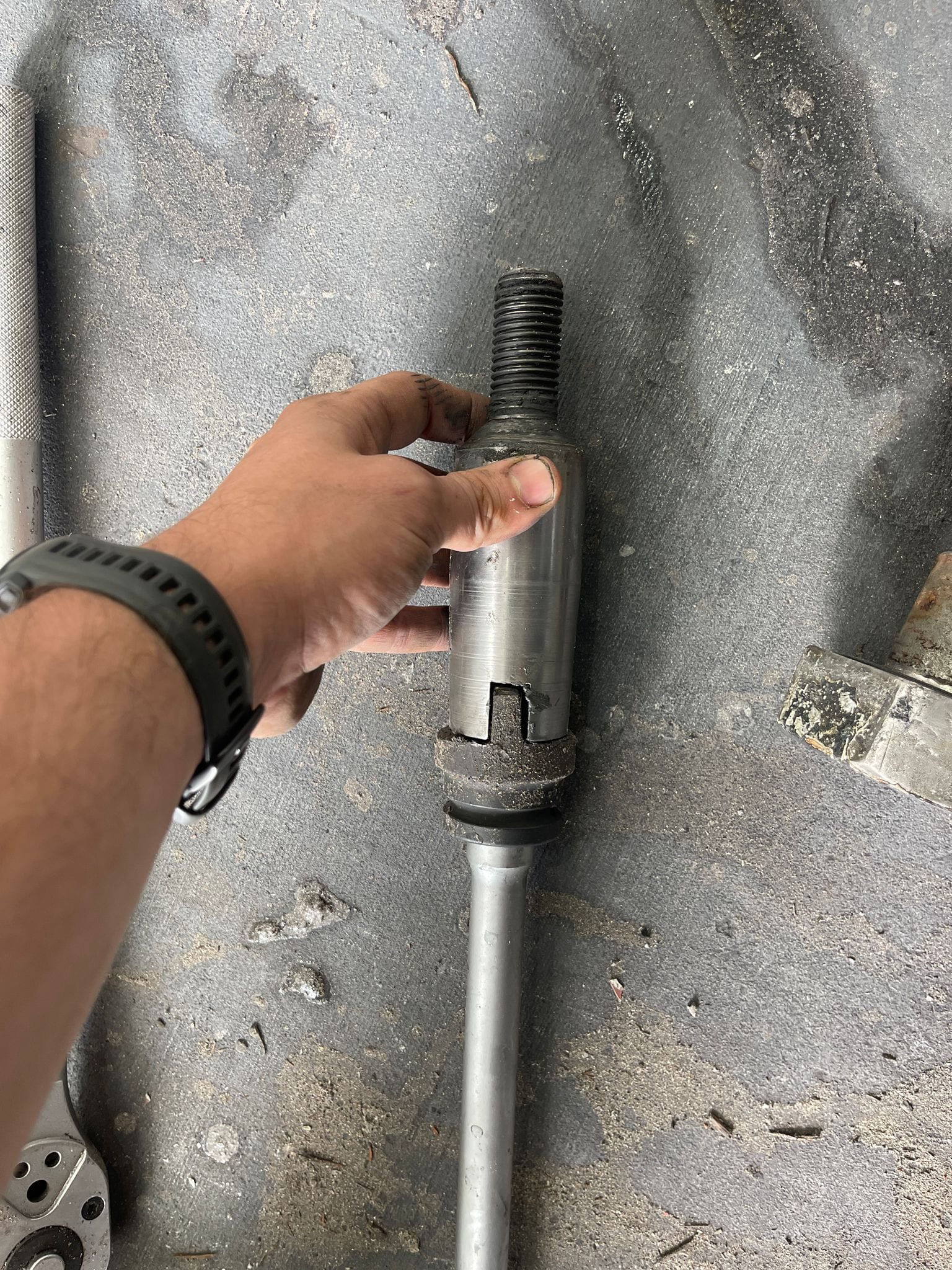 Extraction tool cut from an impact socket to release the fin locking shaft