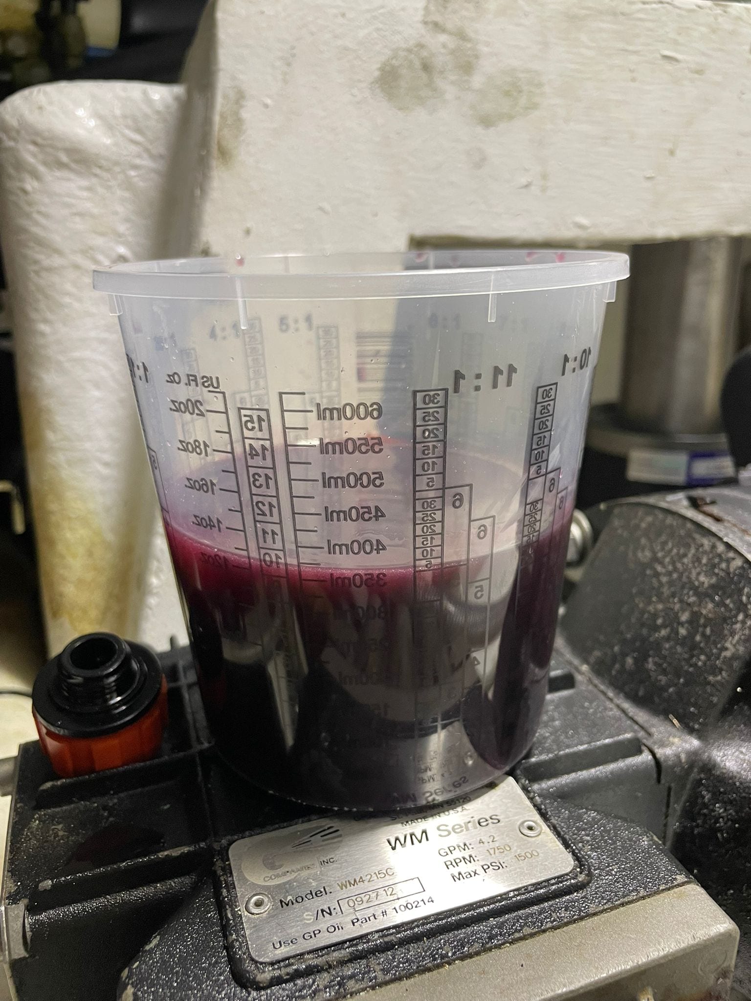 Old oil drained from the watermaker high-pressure pump