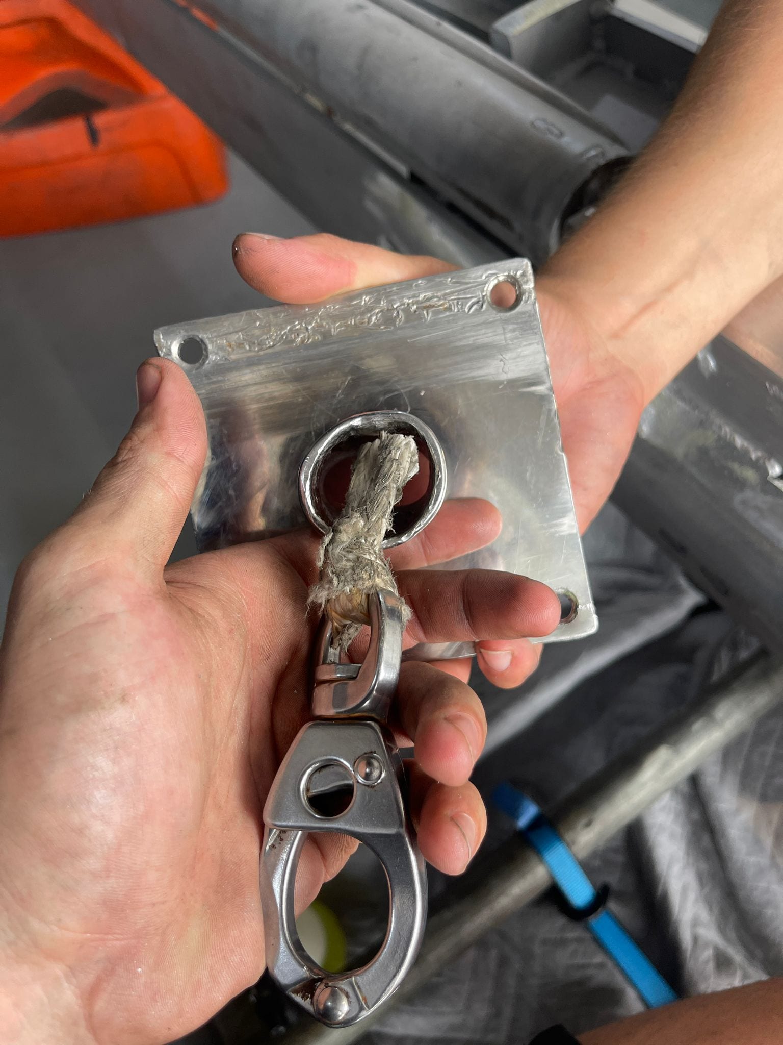 Worn line and swivel snap shackle at the boom-head plate — the failure point