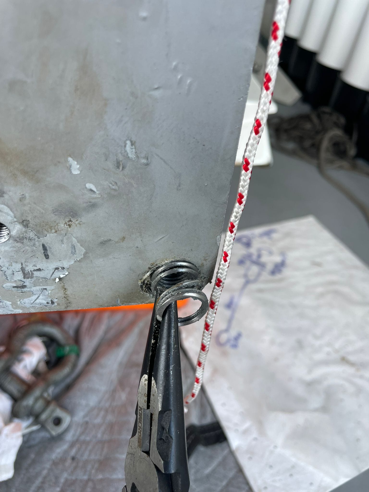 New stainless helicoil insert winding into the repaired thread