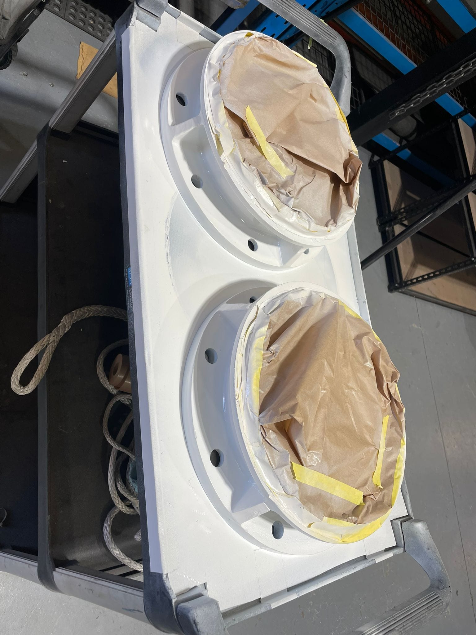 Adaptor plates and top flanges sandblasted, primed and painted, bores masked