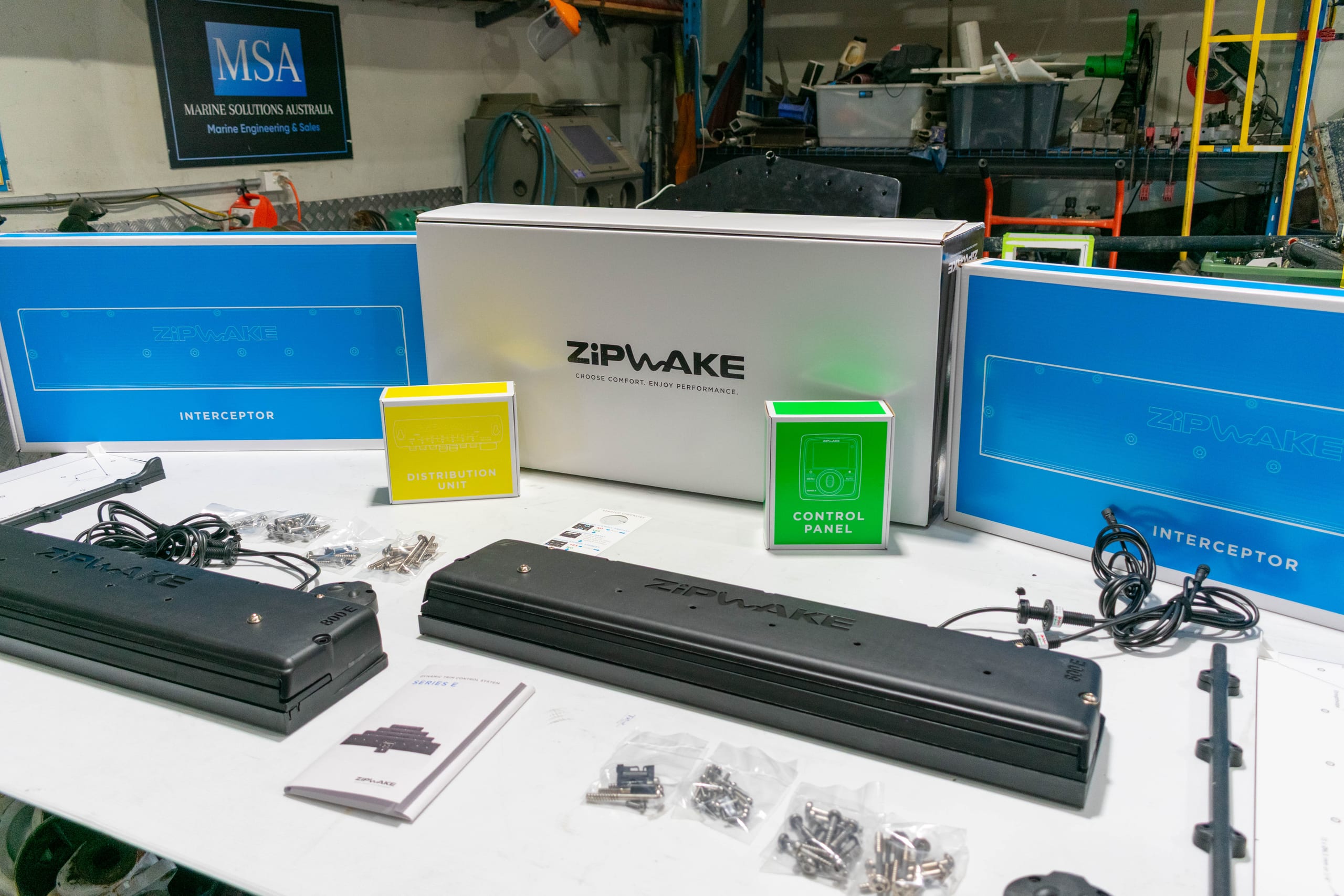 A full Zipwake Series E interceptor kit laid out on the workshop bench